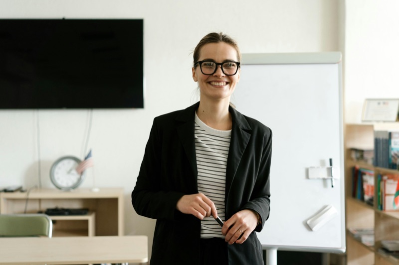 Trainer smiling in a training room